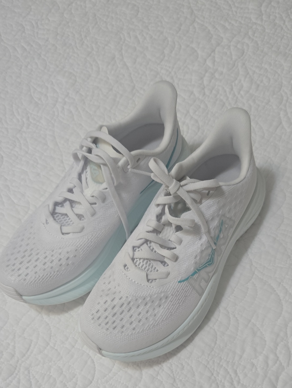 Hoka One One White Running Shoes with Light Blue Accents